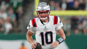 Sep 19, 2024; East Rutherford, New Jersey, USA; New England Patriots quarterback Drake Maye (10) looks to pass against the New York Jets during the fourth quarter at MetLife Stadium. Mandatory Credit: Brad Penner-Imagn Images