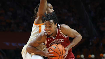 Arkansas Razorbacks guard D.J. Wagner (21) drives against Tennessee Volunteers guard Chaz Lanier (2) during the second half at Thompson-Boling Arena at Food City Center. 