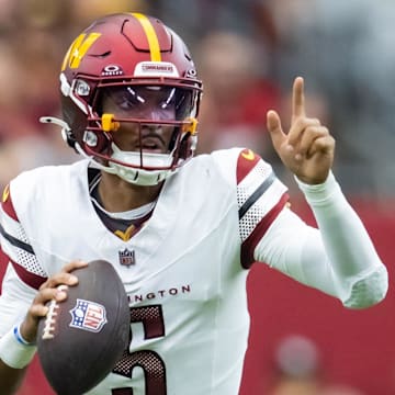 Sep 29, 2024; Glendale, Arizona, USA; Washington Commanders quarterback Jayden Daniels (5) against the Arizona Cardinals at State Farm Stadium. Mandatory Credit: Mark J. Rebilas-Imagn Images