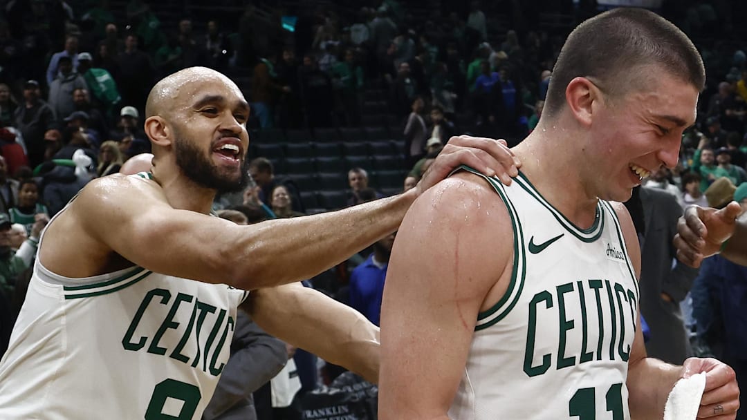 Mar 5, 2025; Boston, Massachusetts, USA; For the first time in Boston Celtics history, two teammates scored over 40 points in a game, Boston Celtics guard Derrick White (9), 41 points, and guard Payton Pritchard (11) ,43 points as they joke around after their win over the Portland Trail Blazers at TD Garden. Mandatory Credit: Winslow Townson-Imagn Images