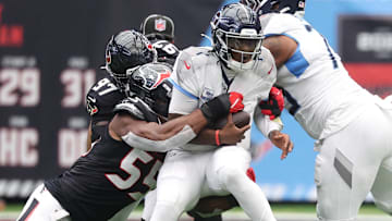 Houston Texans defensive end Danielle Hunter (55) sacks Tennessee Titans quarterback Cam Ward (1) during the first half at NRG Stadium.