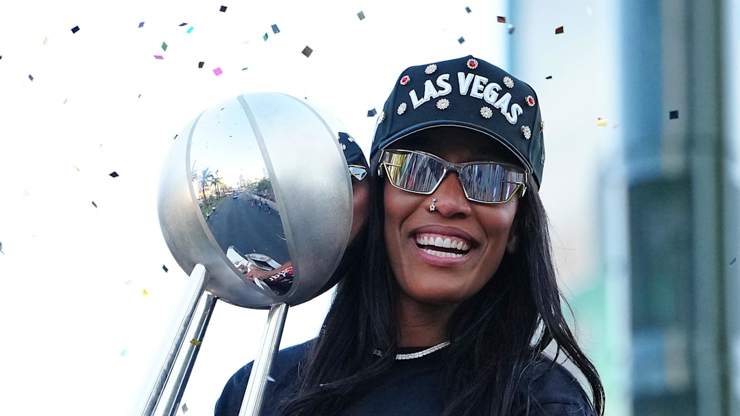 Oct 17, 2025; Las Vegas, NV, USA; Las Vegas Aces center A'Ja Wilson (22) celebrates during the 2025 WNBA Championship parade at Toshiba Plaza. Mandatory Credit: Stephen R. Sylvanie-Imagn Images