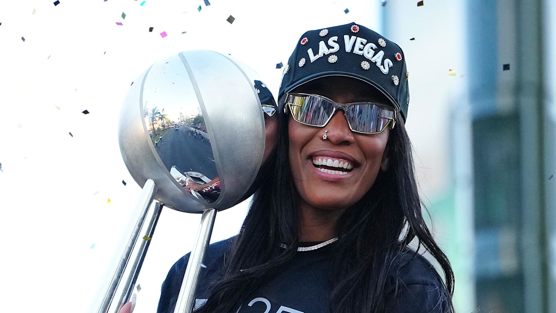 Oct 17, 2025; Las Vegas, NV, USA; Las Vegas Aces center A'Ja Wilson (22) celebrates during the 2025 WNBA Championship parade at Toshiba Plaza. Mandatory Credit: Stephen R. Sylvanie-Imagn Images