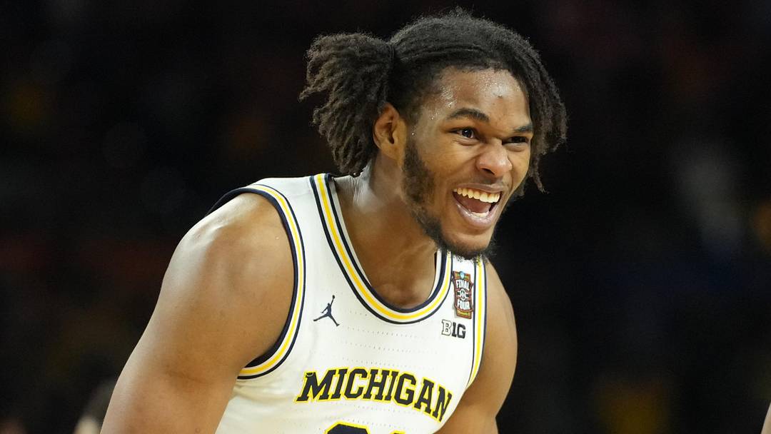 Apr 6, 2026; Indianapolis, IN, USA; Michigan Wolverines forward Morez Johnson Jr. (21) celebrates after defeating the Connecticut Huskies in the national championship of the Final Four of the men's 2026 NCAA Tournament at Lucas Oil Stadium. Mandatory Credit: Robert Deutsch-Imagn Images Apr 6, 2026; Indianapolis, IN, USA; Michigan Wolverines forward Morez Johnson Jr. (21) celebrates after defeating the Connecticut Huskies in the national championship of the Final Four of the men's 2026 NCAA Tournament at Lucas Oil Stadium. Mandatory Credit: Robert Deutsch-Imagn Images