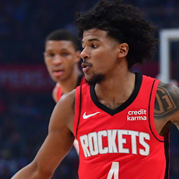 Apr 14, 2024; Los Angeles, California, USA; Houston Rockets guard Jalen Green (4) moves the ball against the Los Angeles Clippers during the first half at Crypto.com Arena. Mandatory Credit: Gary A. Vasquez-Imagn Images