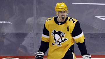 May 24, 2021; Pittsburgh, Pennsylvania, USA; Pittsburgh Penguins center Evgeni Malkin (71) reacts after scoring a power play goal against the New York Islanders during the first period in game five of the first round of the 2021 Stanley Cup Playoffs at PPG Paints Arena. Mandatory Credit: Charles LeClaire-Imagn Images
