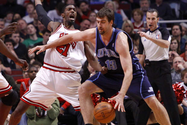 Mar 09, 2010; Chicago, IL, USA; Chicago Bulls forward Hakim Warrick (21) plays defense on Utah Jazz center Mehmet Okur (13) during the first half at the United Center.  Mandatory Credit: Mike DiNovo-USA TODAY Sports