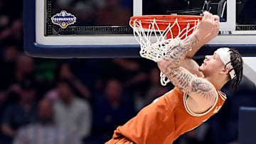 Texas guard Chendall Weaver (2) hangs on the rim after basket by a teammate against Vanderbilt during a NCAA college basketball first round game at the men’s Southeastern Conference Tournament Wednesday, March 12, 2025, in Nashville, Tenn.