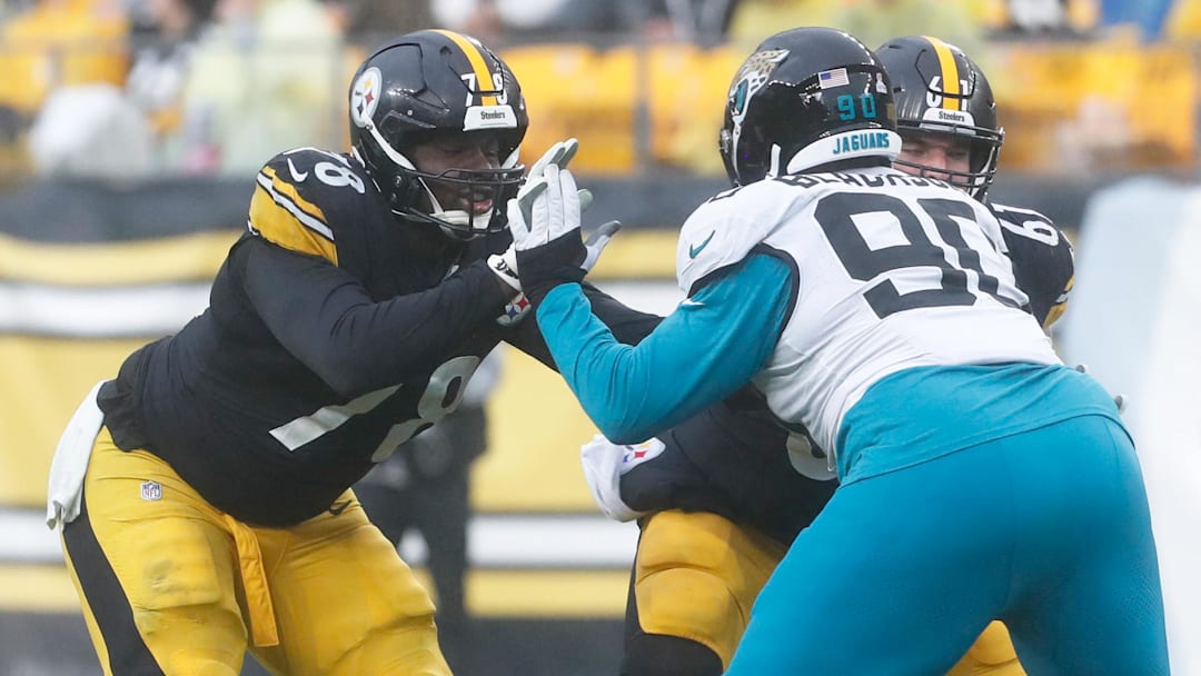 Pittsburgh Steelers guard James Daniels blocks at the line of scrimmage against Jacksonville Jaguars defensive end Angelo Blackson during the fourth quarter at Acrisure Stadium.
