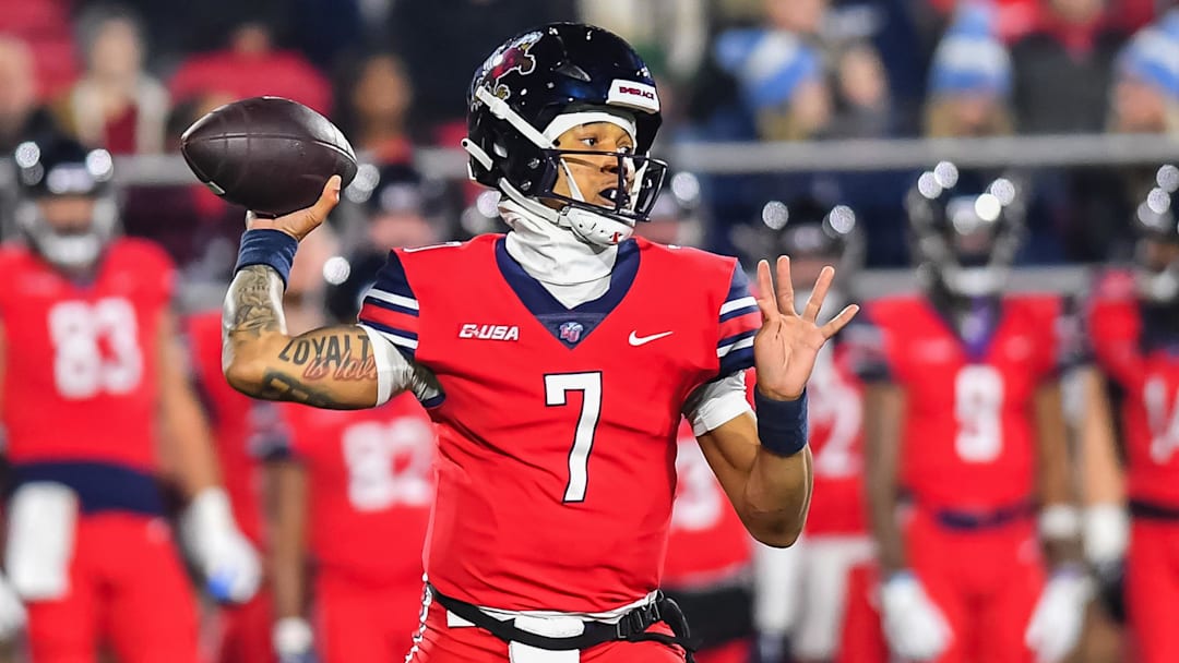 Dec 1, 2023; Lynchburg, VA, USA; Liberty Flames quarterback Kaidon Salter (7) throws a pass during the first quarter against the New Mexico State Aggies at Williams Stadium. Mandatory Credit: Brian Bishop-Imagn Images