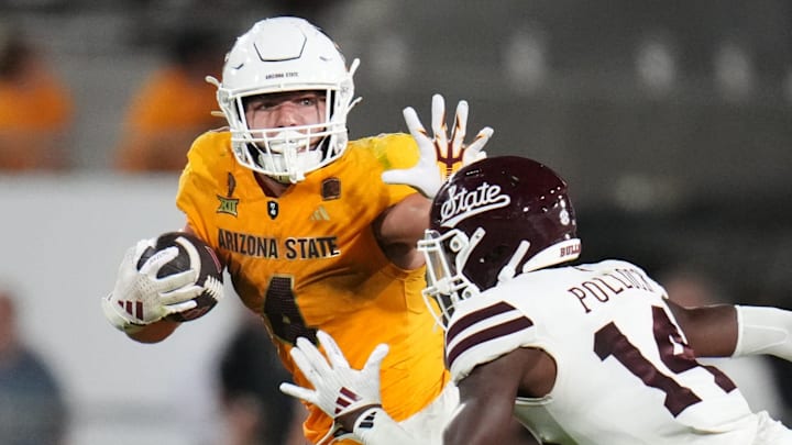 Arizona State running back Cam Skattebo stiff arms his way past Mississippi State cornerback Brice Pollock at Mountain America Stadium. The Bulldogs hope Skattebo didn't also stiff arm them out of a bowl game.