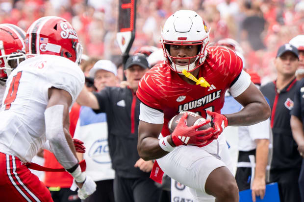 Louisville Cardinals tight end Jamari Johnson (11) runs the ball 