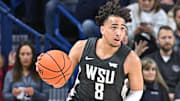 Jan 11, 2025; Spokane, Washington, USA; Washington State Cougars guard Nate Calmese (8) controls the ball against the Gonzaga Bulldogs in the first half at McCarthey Athletic Center. Mandatory Credit: James Snook-Imagn Images