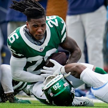 New York Jets cornerback Brandin Echols (26) intercepts a ball intended for Tennessee Titans wide receiver Treylon Burks (16) during the second quarter at Nissan Stadium in Nashville, Tenn., Sunday, Sept. 15, 2024.