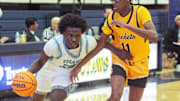 Richland's Phil Nelson (20) drives toward the basket past Starkville defender Justin Green (11) during the BA$$A Holiday Invitational 2023 in Clinton, Miss., Saturday, Dec. 23, 2023.