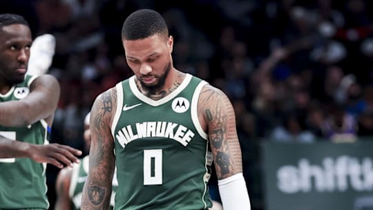 Mar 1, 2025; Dallas, Texas, USA;  Milwaukee Bucks guard Damian Lillard (0) and Milwaukee Bucks forward Taurean Prince (12) react against the Dallas Mavericks during the first half at American Airlines Center. Mandatory Credit: Kevin Jairaj-Imagn Images