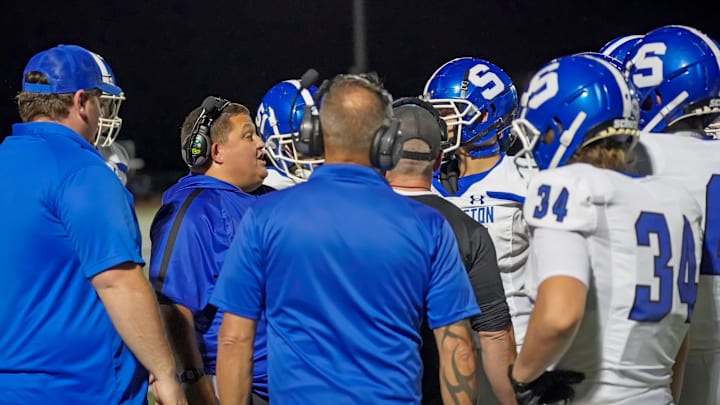 Southington football coach Rob Levesque speaks to his team during a timeout during a game last season. 