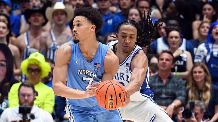 Mar 7, 2026; Durham, North Carolina, USA;Duke Blue Devils forward Maliq Brown (6) pokes the ball away from North Carolina Tar Heels guard Seth Trimble (7) during the second half at Cameron Indoor Stadium.  The Duke Blue Devils won 76-61. Mandatory Credit: Rob Kinnan-Imagn Images