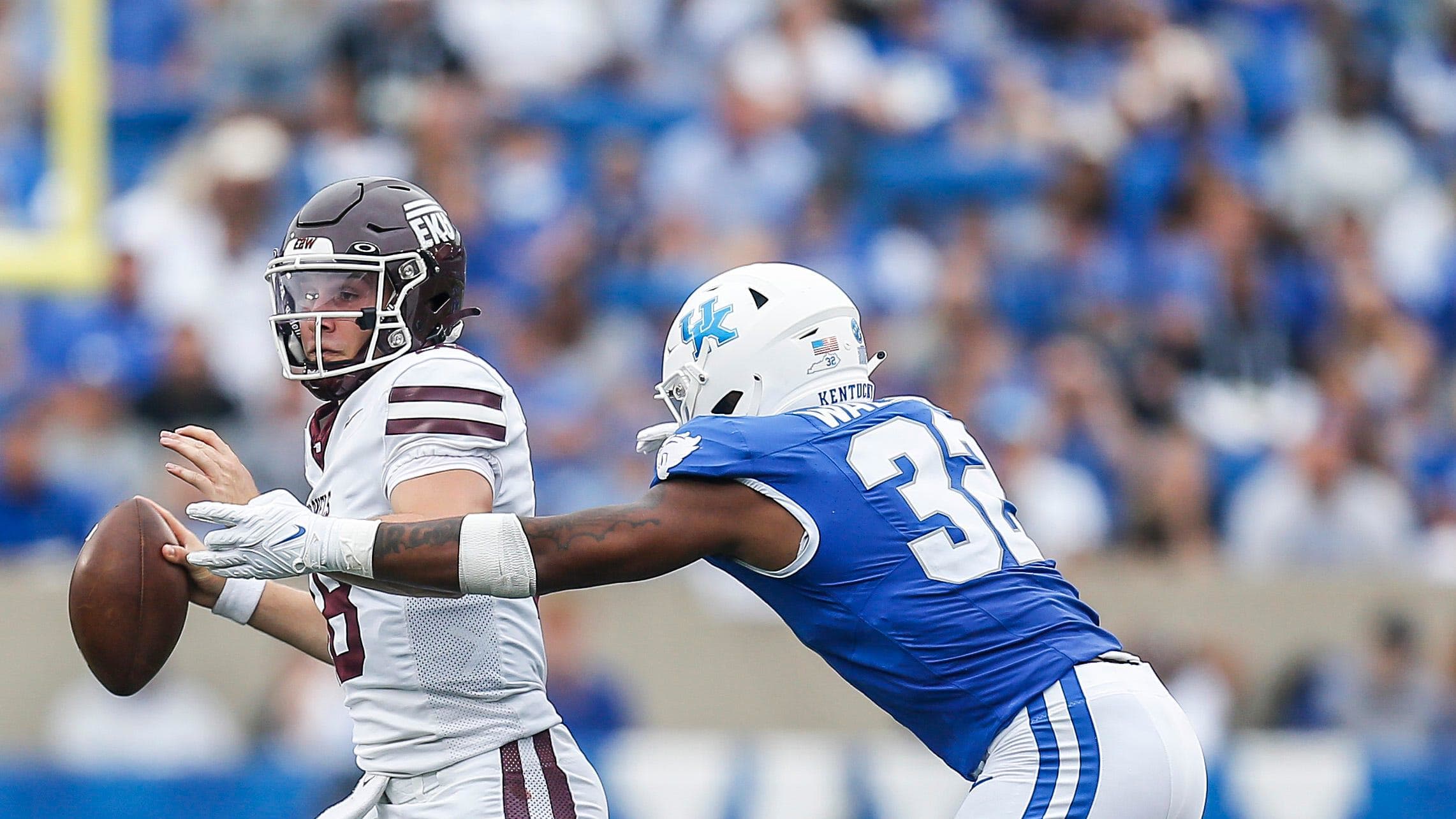 Kentucky Wildcats linebacker Trevin Wallace pressures an Eastern Kentucky Colonels quarterback.