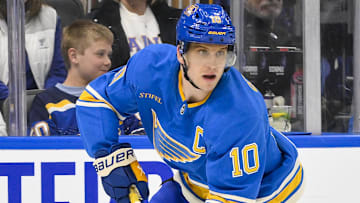 Mar 1, 2025; St. Louis, Missouri, USA;  St. Louis Blues center Brayden Schenn (10) controls the puck against the Los Angeles Kings during the second period at Enterprise Center. Mandatory Credit: Jeff Curry-Imagn Images