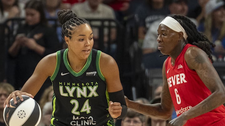 Jul 1, 2025; Minneapolis, Minnesota, USA; Minnesota Lynx forward Napheesa Collier (24) backs towards the basket against Indiana Fever forward Natasha Howard (6) in the first half during the Commissioner's Cup final at Target Center. Mandatory Credit: Jesse Johnson-Imagn Images