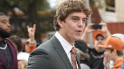 Nov 1, 2025; Austin, Texas, USA; Texas Longhorns quarterback Arch Manning (16) rouses the fans when entering Darrell K Royal-Texas Memorial Stadium before a game against the Vanderbilt Commodores. Mandatory Credit: Scott Wachter-Imagn Images