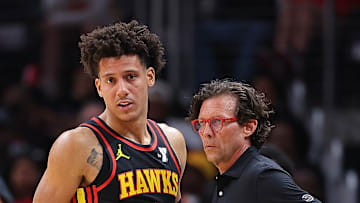 Johnson listening to advice from Head Coach Quin Snyder on the sideline.