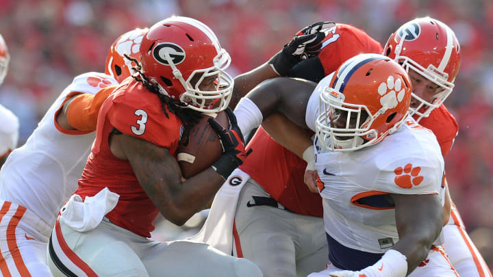 Clemson defensive end Vic Beasley (3), left, and defensive tackle Grady Jarrett (50) stop Georgia tail back Todd Gurley (3) during the 1st quarter at Georgia's Sanford Stadium Saturday, August 30, 2014.

Clemson Georgia Football