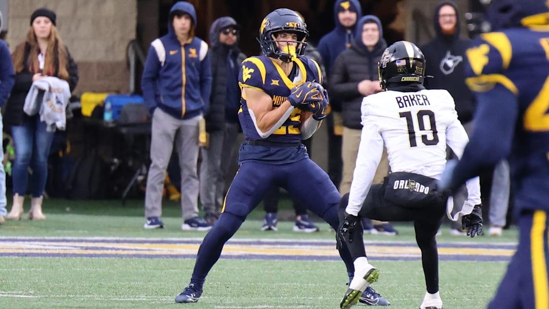 West Virginia University receiver Preston Fox hauling in a punt against UCF.