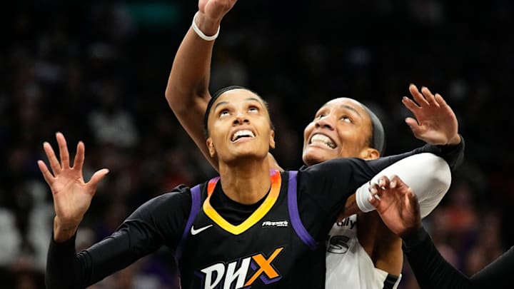 Phoenix Mercury forward DeWanna Bonner (14) battles for position with Las Vegas Aces center A'ja Wilson (22) in Game Four of the WNBA Finals at Mortgage Matchup Center on Oct. 10, 2025, in Phoenix.