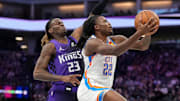 Nov 7, 2025; Sacramento, California, USA; Oklahoma City Thunder guard Cason Wallace (22) drives past Sacramento Kings guard Keon Ellis (23) in the fourth quarter at the Golden 1 Center. Mandatory Credit: Cary Edmondson-Imagn Images