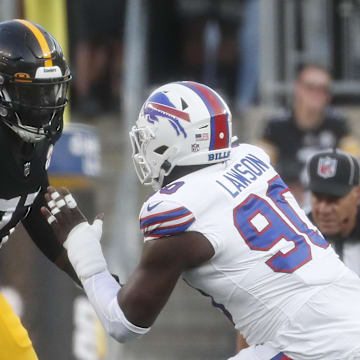 Aug 19, 2023; Pittsburgh, Pennsylvania, USA;  Pittsburgh Steelers offensive tackle Broderick Jones (77) run blocks at the line of scrimmage against Buffalo Bills defensive end Shaq Lawson (90) during the second quarter at Acrisure Stadium. Mandatory Credit: Charles LeClaire-Imagn Images