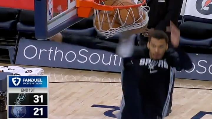 Victor Wembanyama kicks a few basketballs out of the net.