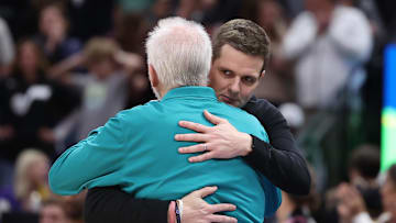 Feb 25, 2023; Salt Lake City, Utah, USA; Utah Jazz head coach Will Hardy (right) and San Antonio Spurs head coach Gregg Popovich hug after a game at Vivint Arena. Mandatory Credit: Rob Gray-Imagn Images