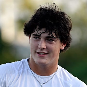 Nashville Christian quarterback Jared Curtis warms up before an high school football scrimmage against Franklin Road Academy Friday, Aug. 16, 2024, in Nashville, Tenn.