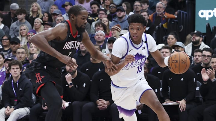 Nov 30, 2025; Salt Lake City, Utah, USA; Utah Jazz guard Ace Bailey (19) drives against Houston Rockets forward Kevin Durant (7) during the second quarter at Delta Center. Mandatory Credit: Rob Gray-Imagn Images