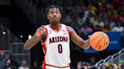 Mar 23, 2025; Seattle, WA, USA;  Arizona Wildcats guard Jaden Bradley (0) dribbles the ball against the Oregon Ducks in the second half at Climate Pledge Arena. Mandatory Credit: Steven Bisig-Imagn Images