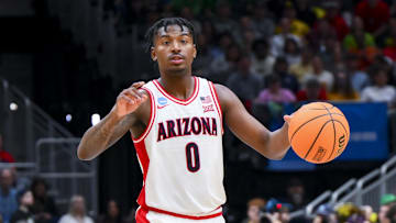 Mar 23, 2025; Seattle, WA, USA;  Arizona Wildcats guard Jaden Bradley (0) dribbles the ball against the Oregon Ducks in the second half at Climate Pledge Arena. Mandatory Credit: Steven Bisig-Imagn Images