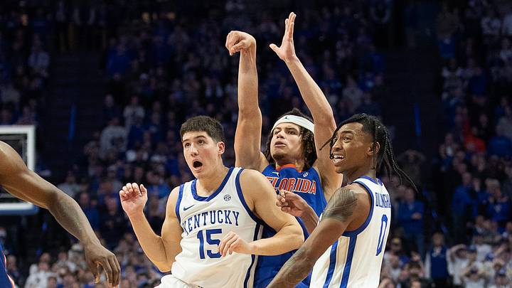 Florida's Walter Clayton Jr. (1), pressured by Kentucky's Reed Sheppard (15) and Rob Dillingham (0), watches as his three pointer went in the basket to force overtime as the Kentucky Wildcats battled the Florida Gators Wednesday night at Rupp Arena. Florida defeated Kentucky in overtime, 94-91. Jan. 31, 2024