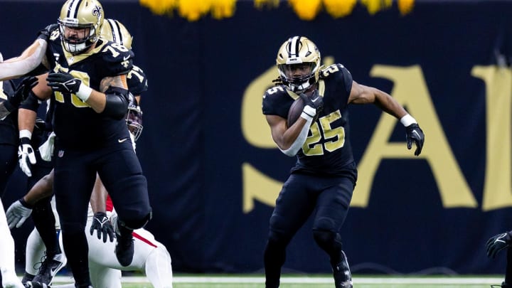 Jan 7, 2024; New Orleans, Louisiana, USA;  New Orleans Saints running back Kendre Miller (25) runs against the Atlanta Falcons during the first half at Caesars Superdome. Mandatory Credit: Stephen Lew-USA TODAY Sports