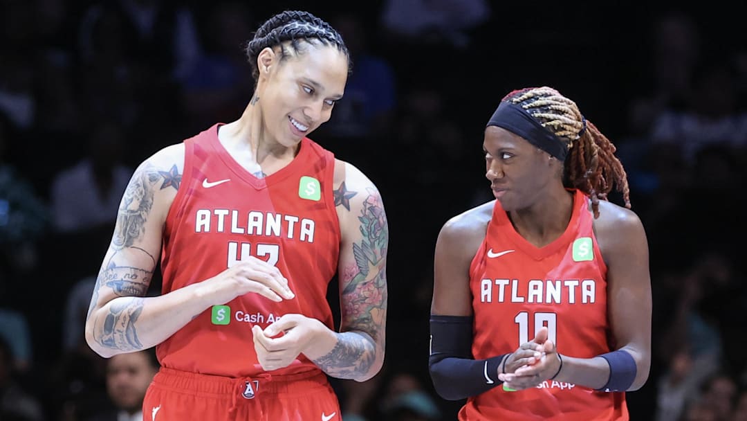 Jun 17, 2025; Brooklyn, New York, USA;  Atlanta Dream center Brittney Griner (42) and guard Rhyne Howard (10) at Barclays Center. Mandatory Credit: Wendell Cruz-Imagn Images