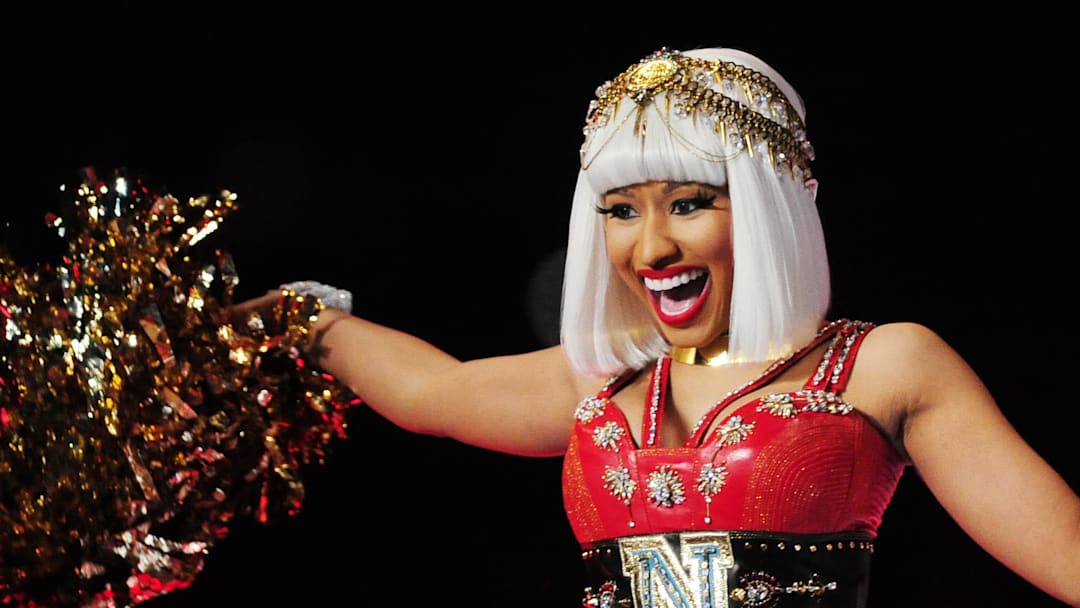 Feb 5, 2012; Indianapolis, IN, USA; Recording artists Nicki Minaj performs with Madonna (not pictured) during the halftime show for Super Bowl XLVI between the New York Giants and New England Patriots at Lucas Oil Stadium.  Mandatory Credit: Mark J. Rebilas-Imagn Images