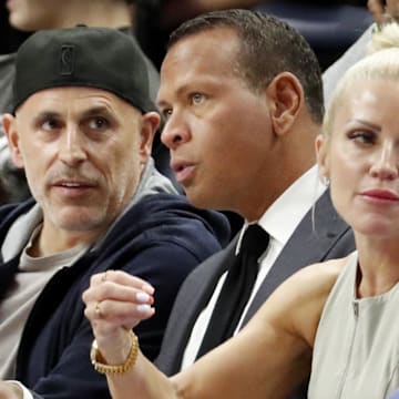 Apr 14, 2024; Minneapolis, Minnesota, USA; Minnesota Timberwolves and Lynx minority owners Marc Lore and Alex Rodriguez talk in the fourth quarter of the game against the Phoenix Suns at Target Center. Mandatory Credit: Bruce Kluckhohn-Imagn Images