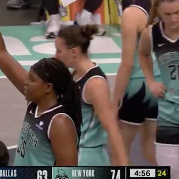 Paige Bueckers twirled her finger alongside Jonquel Jones after scoring an and-one.