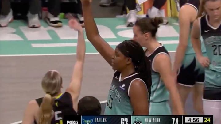 Paige Bueckers twirled her finger alongside Jonquel Jones after scoring an and-one. Paige Bueckers twirled her finger alongside Jonquel Jones after scoring an and-one.