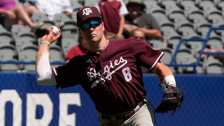 May 21, 2025; Hoover, AL, USA; Texas A&M third baseman Wyatt Henseler (8) fields and throws to first for an out during the game with Mississippi State in the first round of the SEC Baseball Tournament at the Hoover Met.