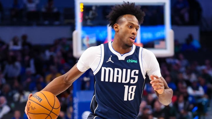 Feb 10, 2024; Dallas, Texas, USA; Dallas Mavericks forward Olivier-Maxence Prosper (18) dribbles during the second half against the Oklahoma City Thunder at American Airlines Center. Mandatory Credit: Kevin Jairaj-USA TODAY Sports