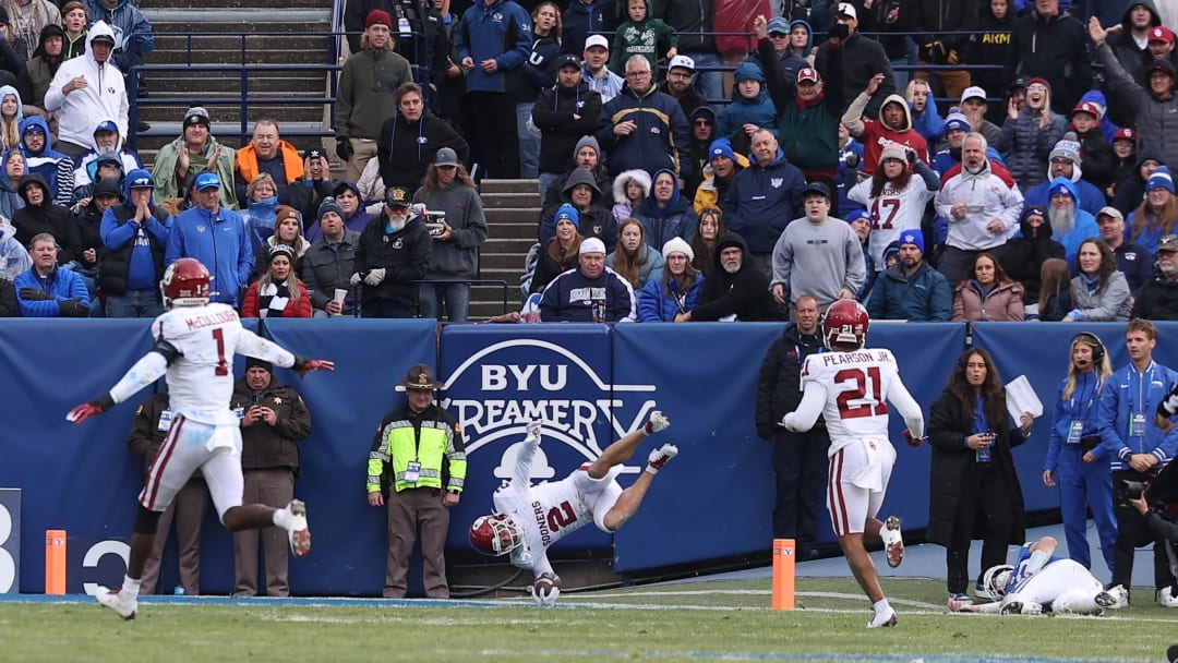 Nov 18, 2023; Provo, Utah, USA; Oklahoma Sooners defensive back Billy Bowman Jr. (2) returns an interception for a touchdown against the Brigham Young Cougars in the third quarter at LaVell Edwards Stadium. Mandatory Credit: Rob Gray-USA TODAY Sports
