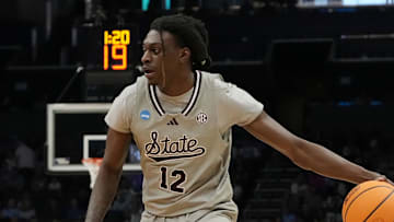 March 21, 2024, Charlotte, NC, USA; Mississippi State Bulldogs forward KeShawn Murphy (12) is defended by Michigan State Spartans forward Malik Hall (25) in the first round of the 2024 NCAA Tournament at the Spectrum Center. Mandatory Credit: Jim Dedmon-Imagn Images