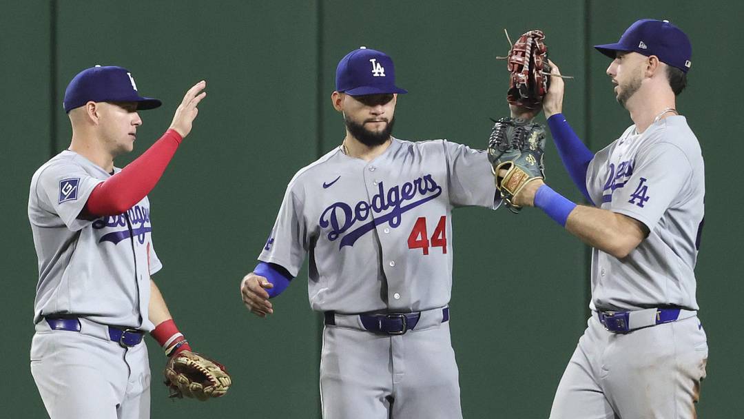 Los Angeles Dodgers celebrate in the outfield after defeating the Pittsburgh Pirates